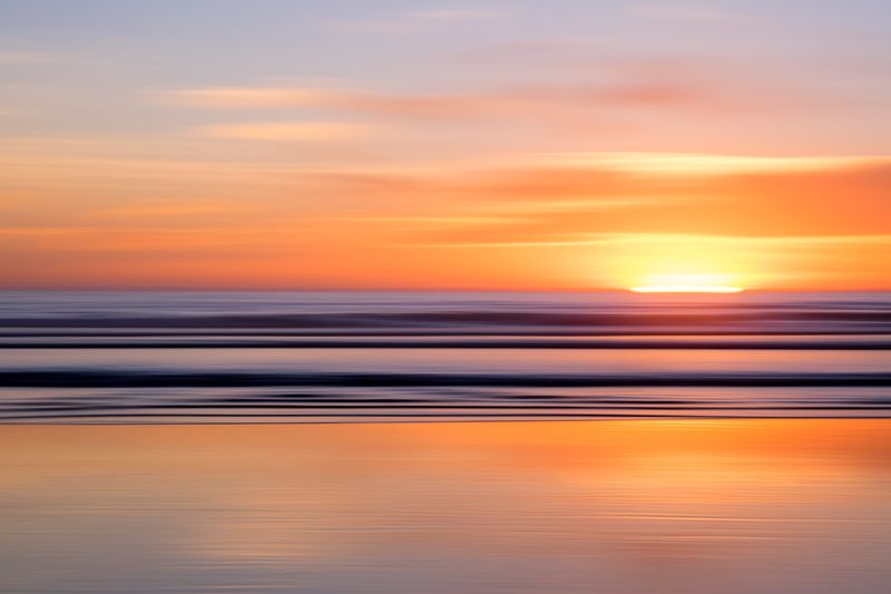 motion panned ocean sunset