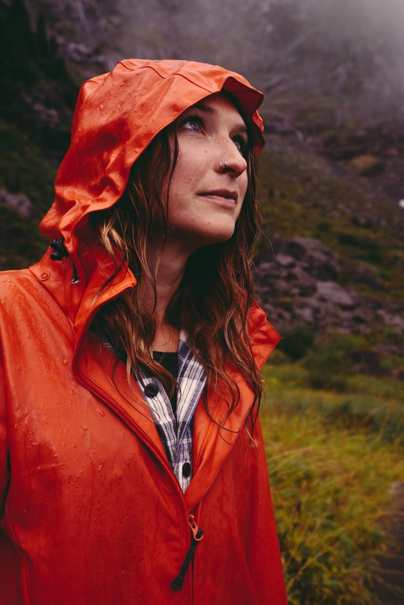 woman in red raincoat